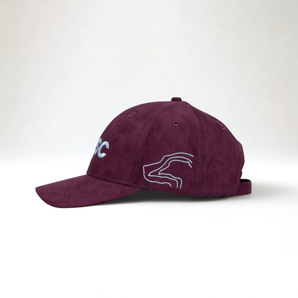 Women in shooting maroon cap