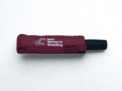 Maroon women in shooting umbrella