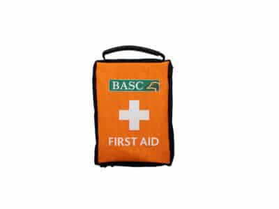 BASC Gundog 1st Aid Kit in bright orange with a carry handle, BASC logo, white cross symbol and "FIRST AID" text on the front.